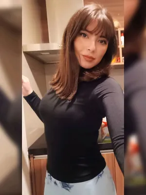 Amanda with a fringe, in a black top