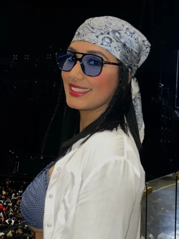 Becky in sunglasses and a bandana