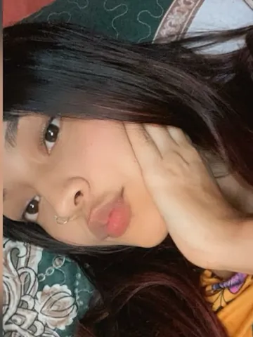 Xims resting her face on her hands